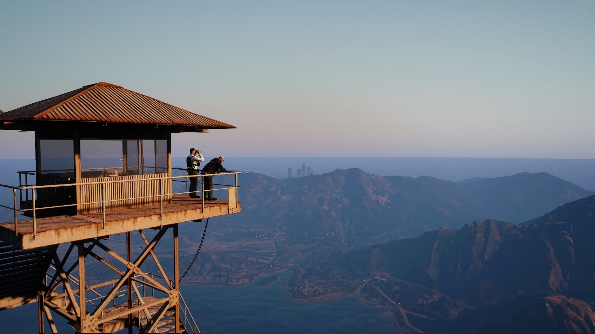 A park ranger watch tower overlooking the wilderness at sunset